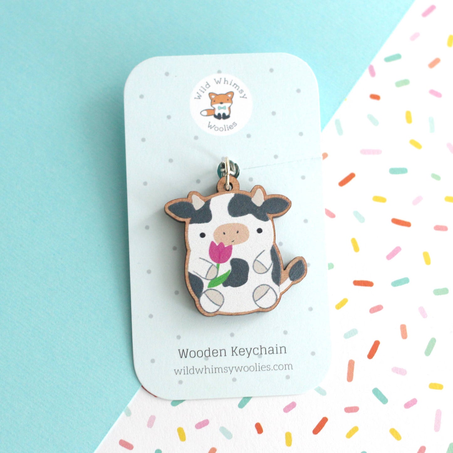 Cow holding a Tulip Wooden Keychain. Cute Cow Wood Charm
