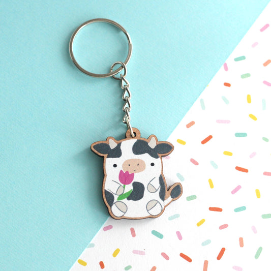 Cow holding a Tulip Wooden Keychain. Cute Cow Wood Charm